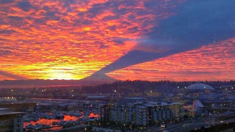 mount rainier morning shadow on thin cloud layer